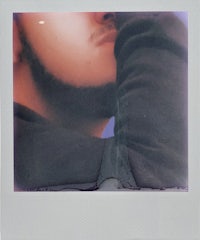 a polaroid of a man with a beard